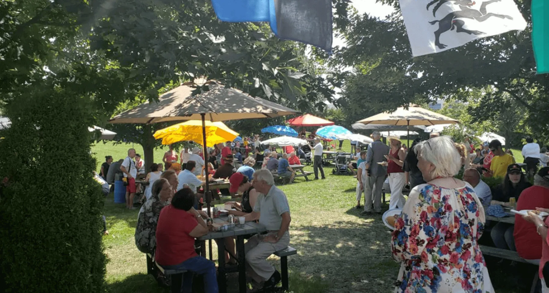 People gathering outdoors at Hansa Haus